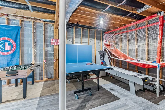 a view of backyard with a deck and furniture