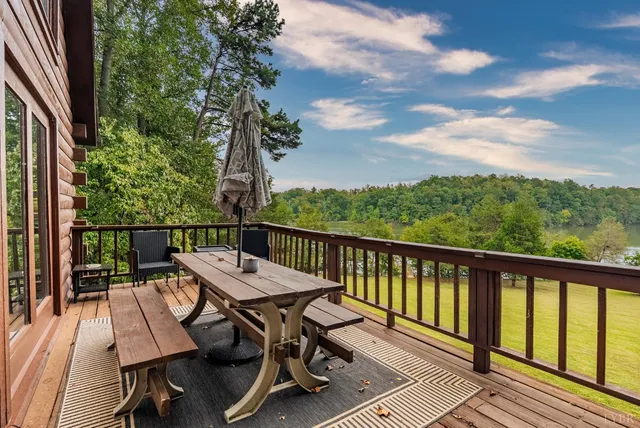 a view of a lake with a house in the background