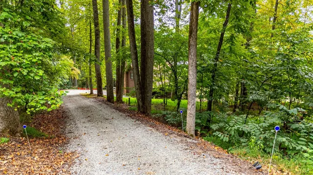 a view of an ocean with a house in the background
