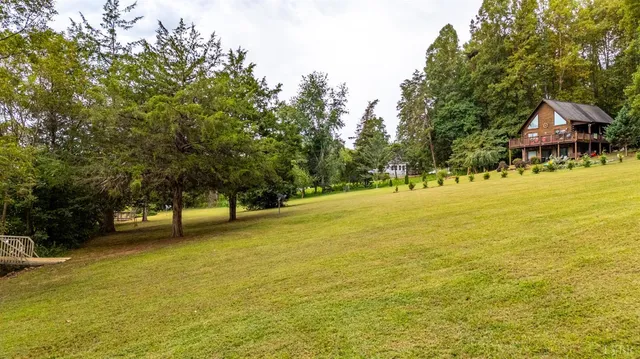 a backyard of a house with lots of green space