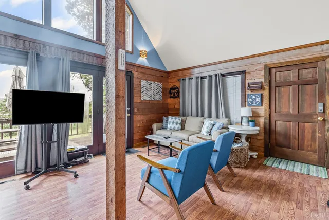 a dining room with furniture and wooden floor