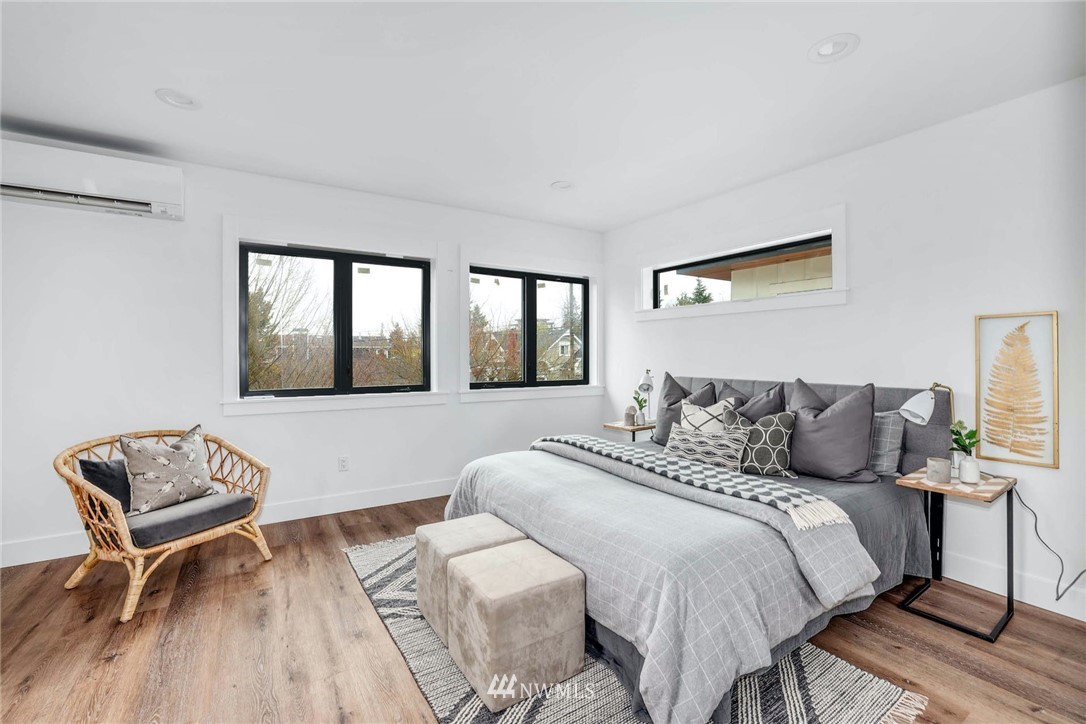 1619 North 50th Street Seattle, WA 98103 - Photo 13 of 37 a bedroom with a bed and a window