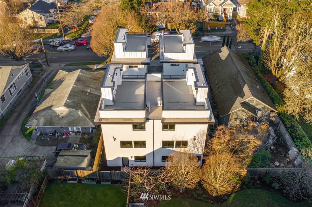 1619 North 50th Street Seattle, WA 98103 - Photo 28 of 37 an aerial view of a residential apartment building with a yard