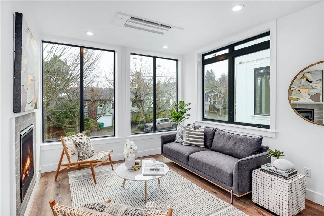 1619 North 50th Street Seattle, WA 98103 - Photo 3 of 37 a living room with furniture and a large window