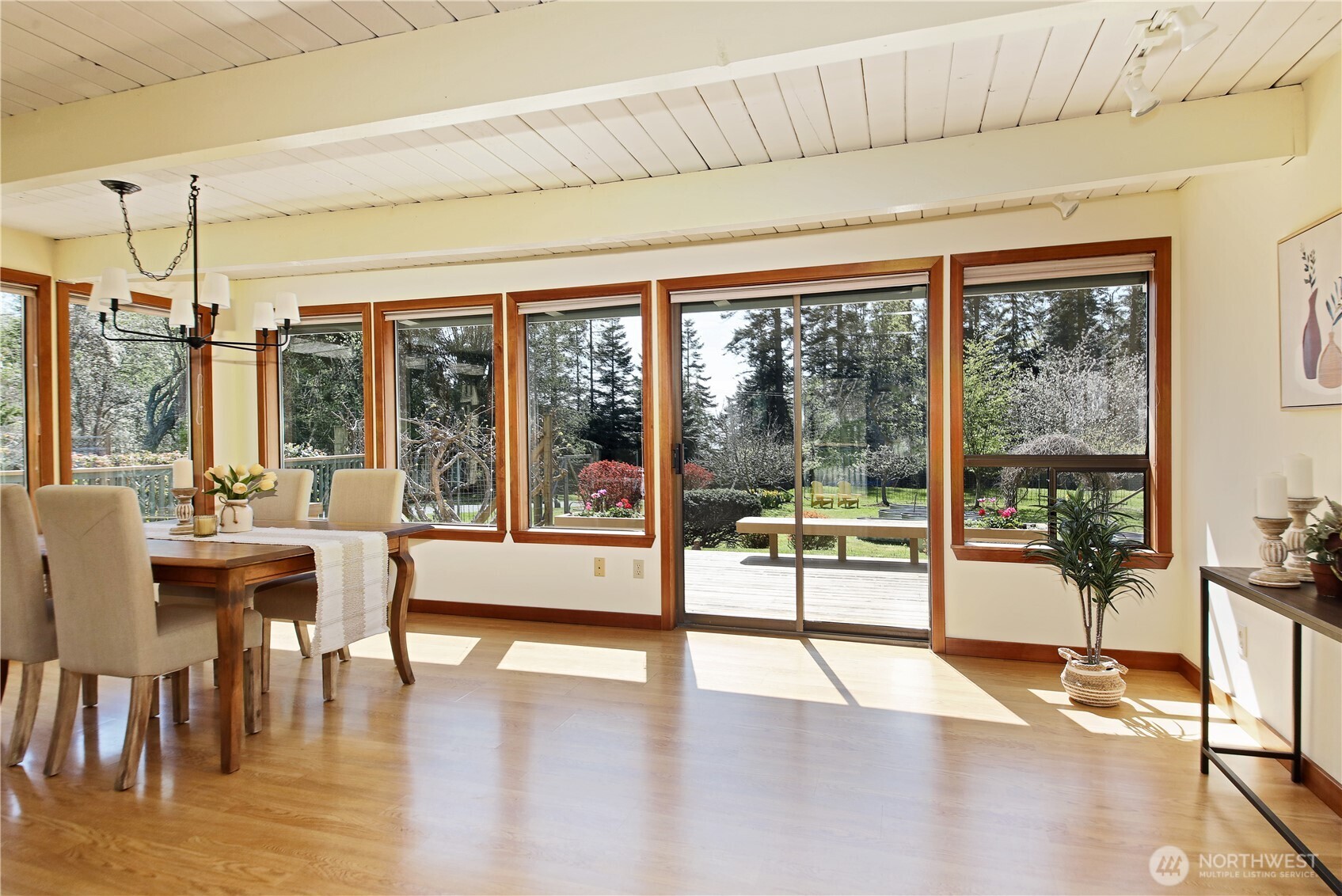 6596 Wahl Road Freeland, WA 98249 - Photo 4 of 39 a view of a dining room with furniture window and wooden floor