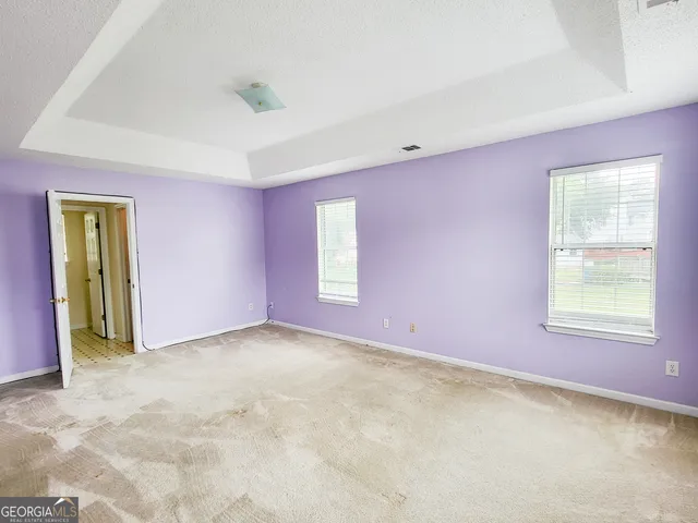 an empty room with windows