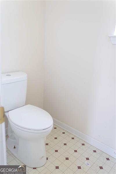 6232 Springwater Lane Lithonia, GA 30058 - Photo 13 of 32 a white toilet sitting next to a shower