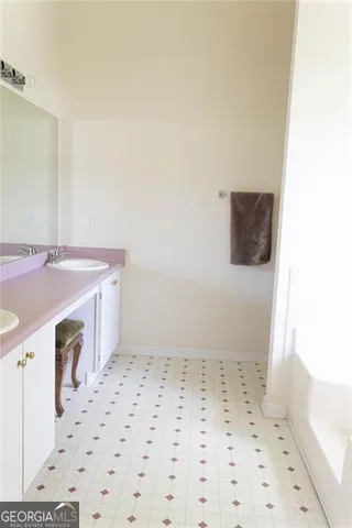 a bathroom with a sink a vanity and a mirror