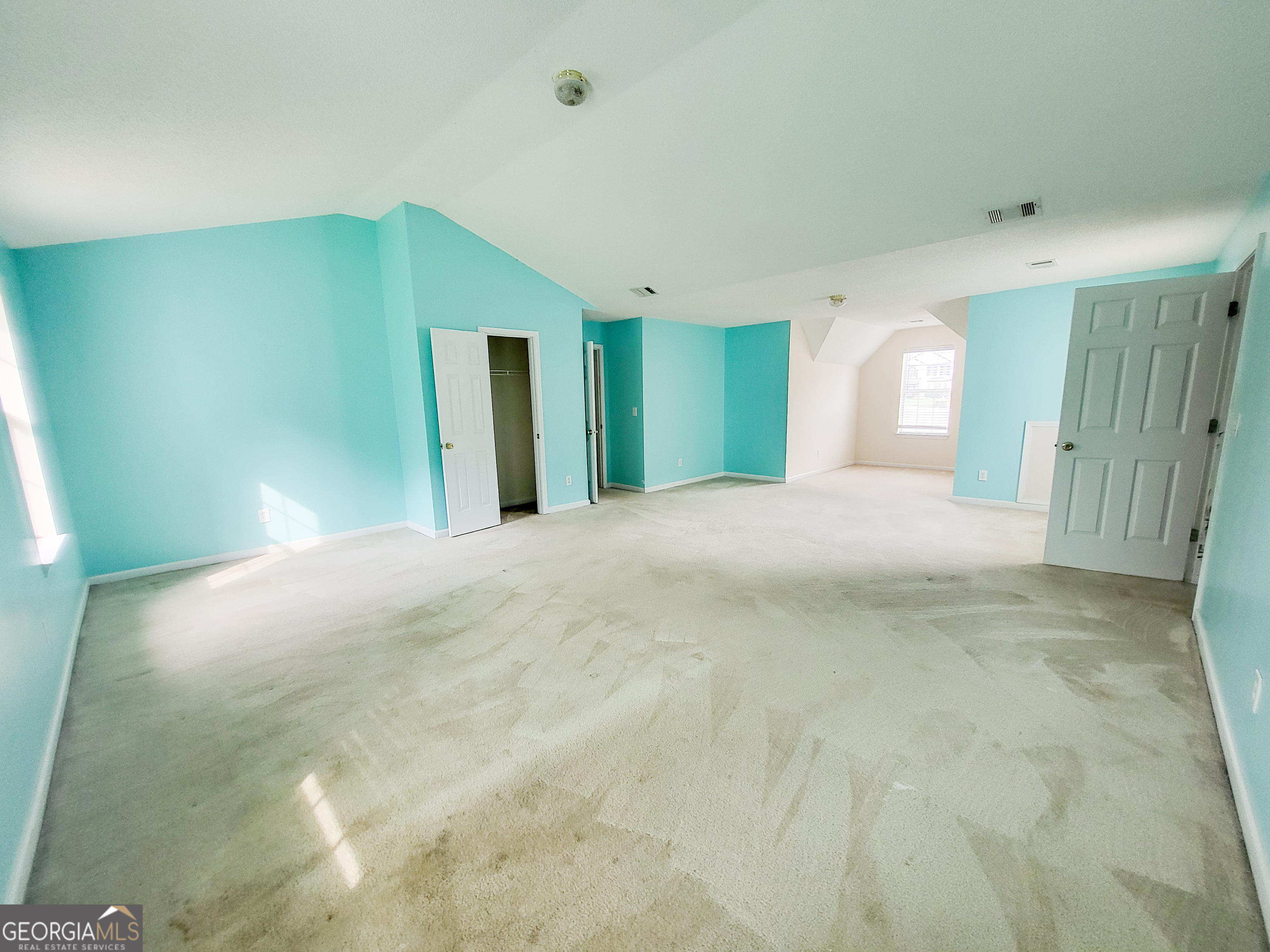6232 Springwater Lane Lithonia, GA 30058 - Photo 22 of 32 a view of a big room with closet and windows