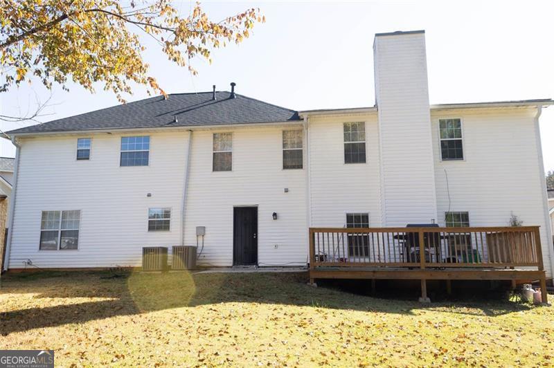 6232 Springwater Lane Lithonia, GA 30058 - Photo 28 of 32 a view of a house with a yard