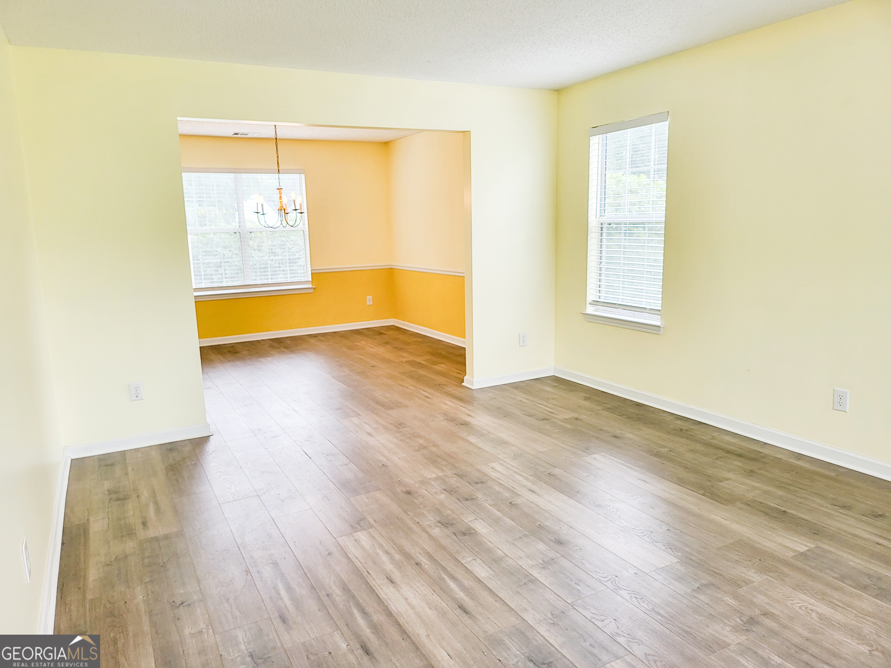 6232 Springwater Lane Lithonia, GA 30058 - Photo 4 of 32 a view of a room with wooden floor and a window