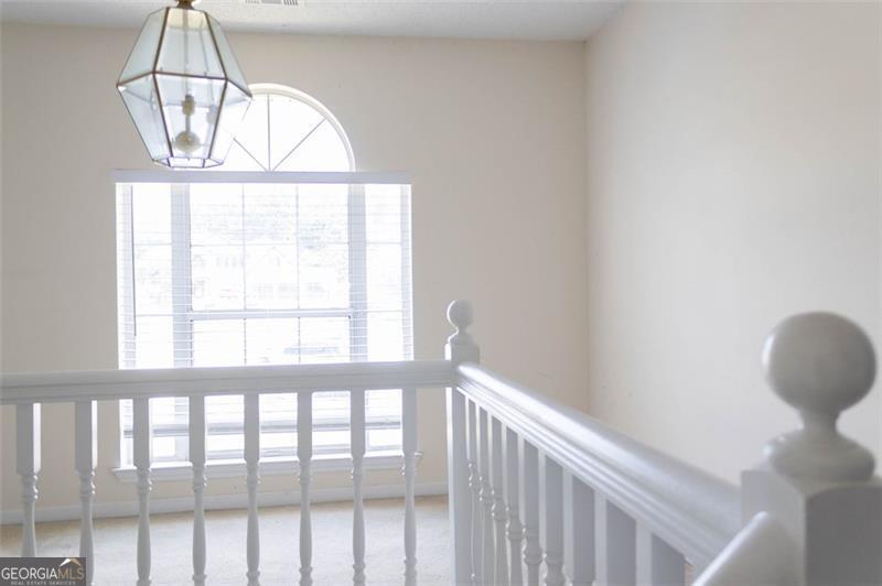 6232 Springwater Lane Lithonia, GA 30058 - Photo 10 of 32 a view of a room that has a window and wooden floor