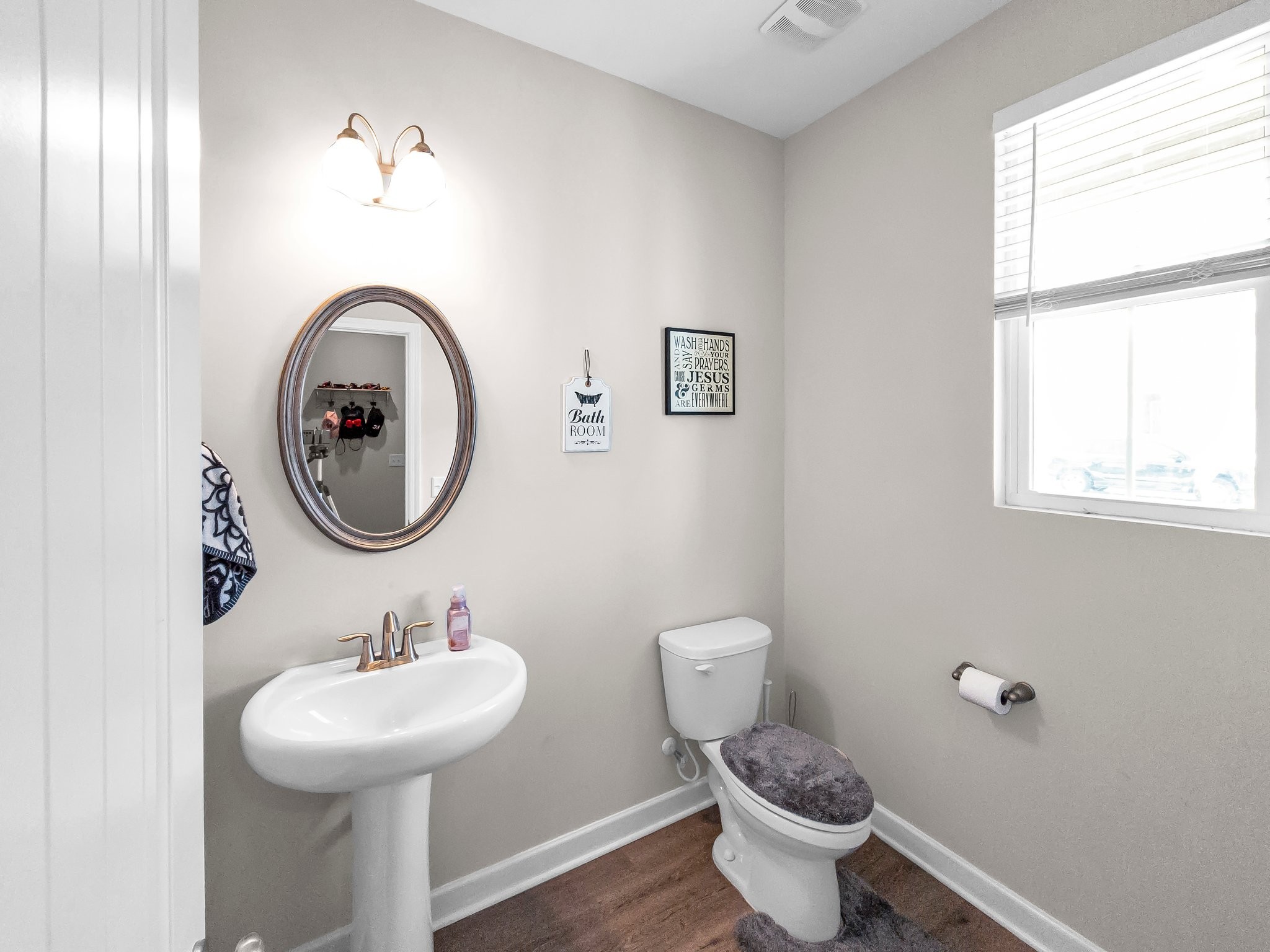 314 Disley Way Murfreesboro, TN 37128 - Photo 21 of 25 a bathroom with a toilet sink and mirror