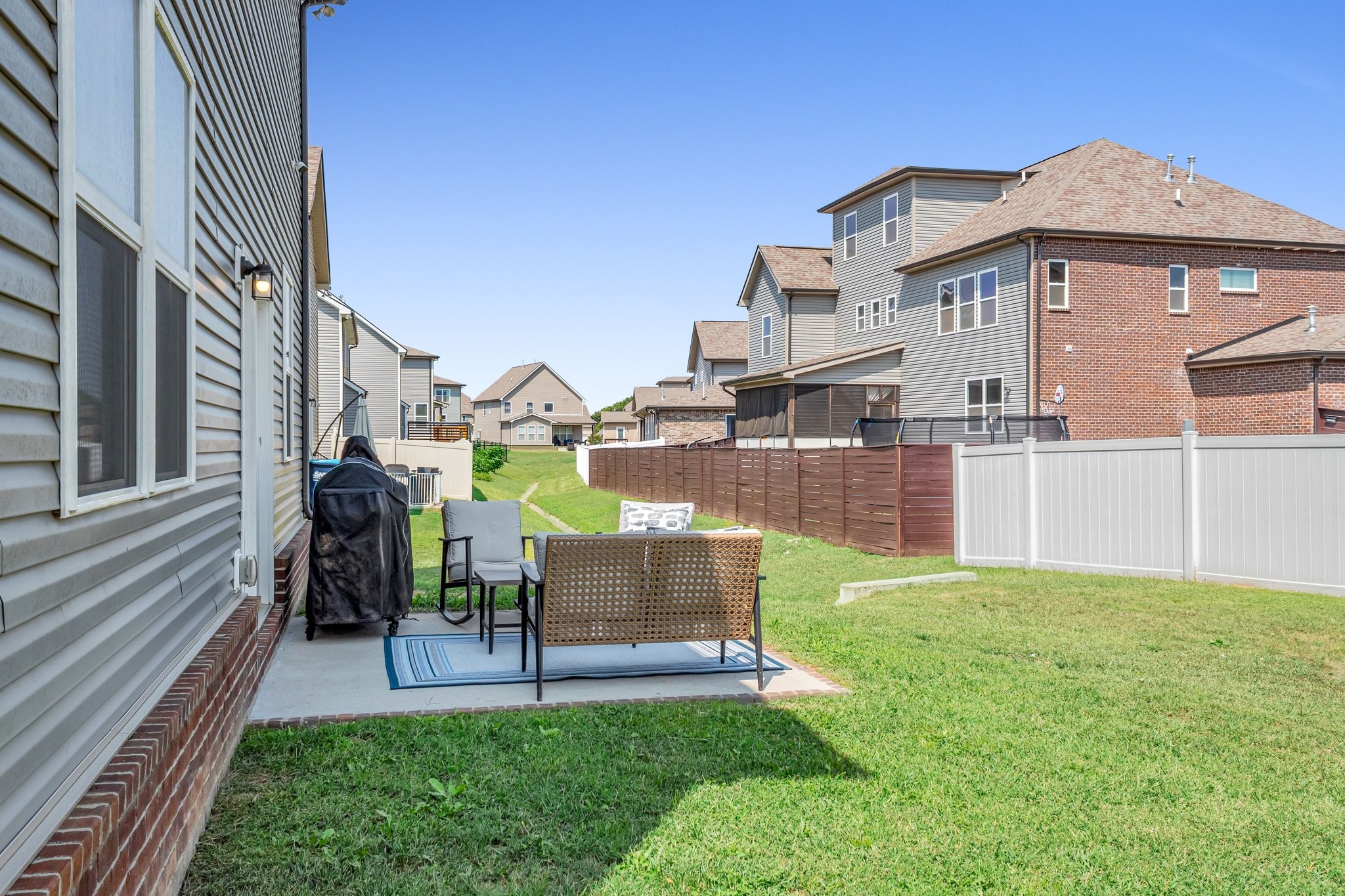 314 Disley Way Murfreesboro, TN 37128 - Photo 23 of 25 a view of a house with a yard and furniture