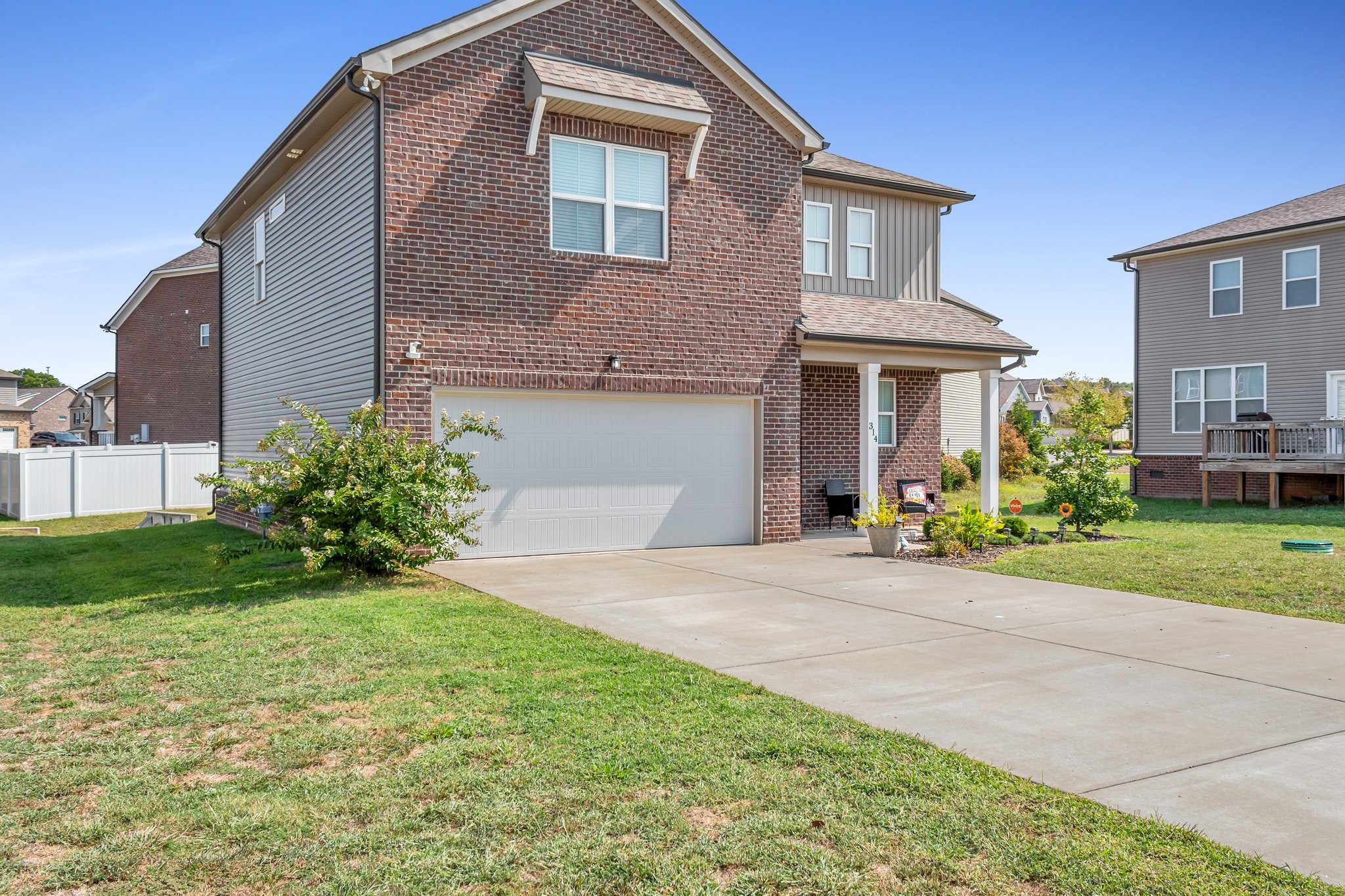 314 Disley Way Murfreesboro, TN 37128 - Photo 3 of 25 a front view of a house with garden