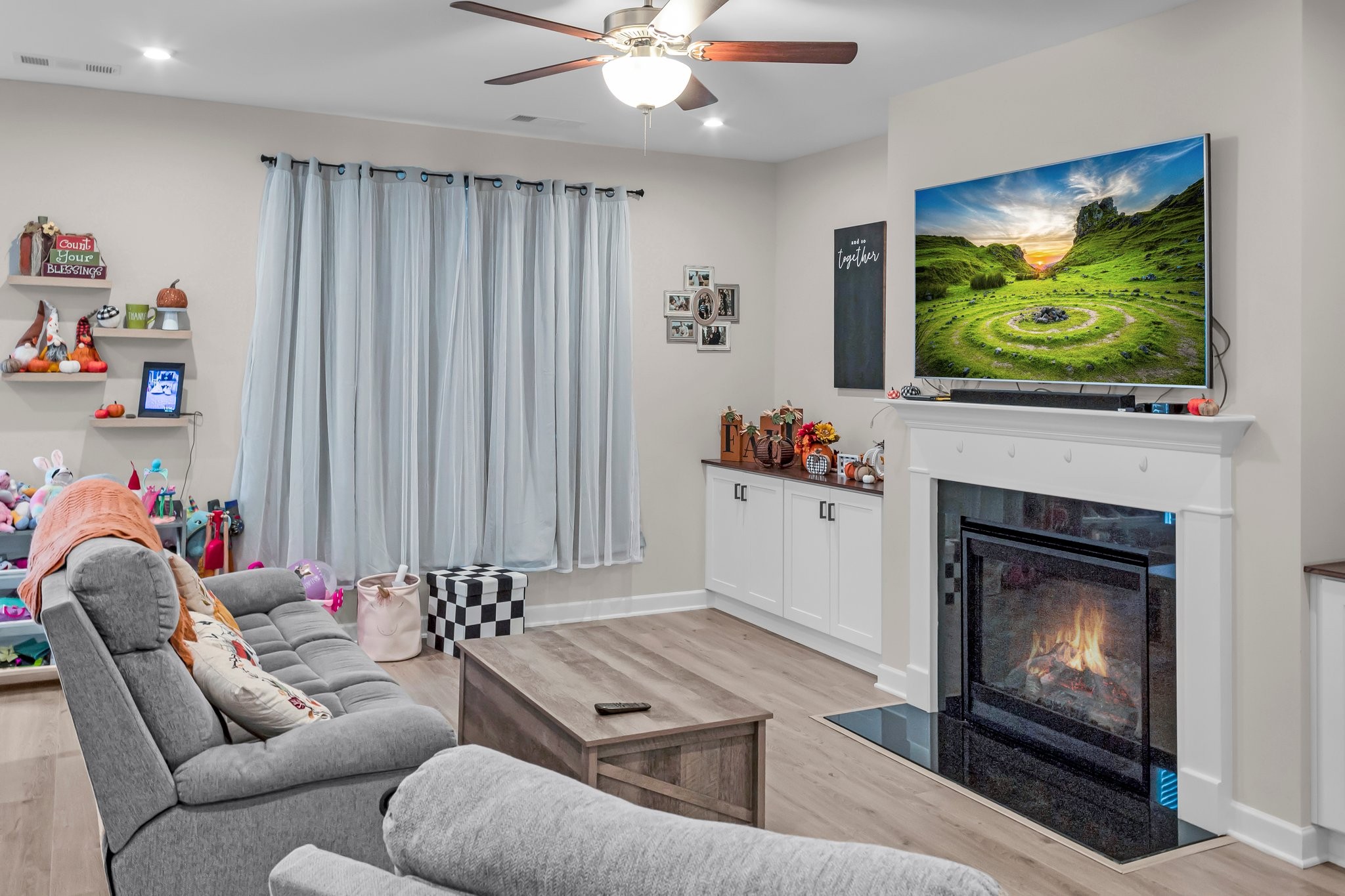 314 Disley Way Murfreesboro, TN 37128 - Photo 4 of 25 a living room with furniture and a fireplace