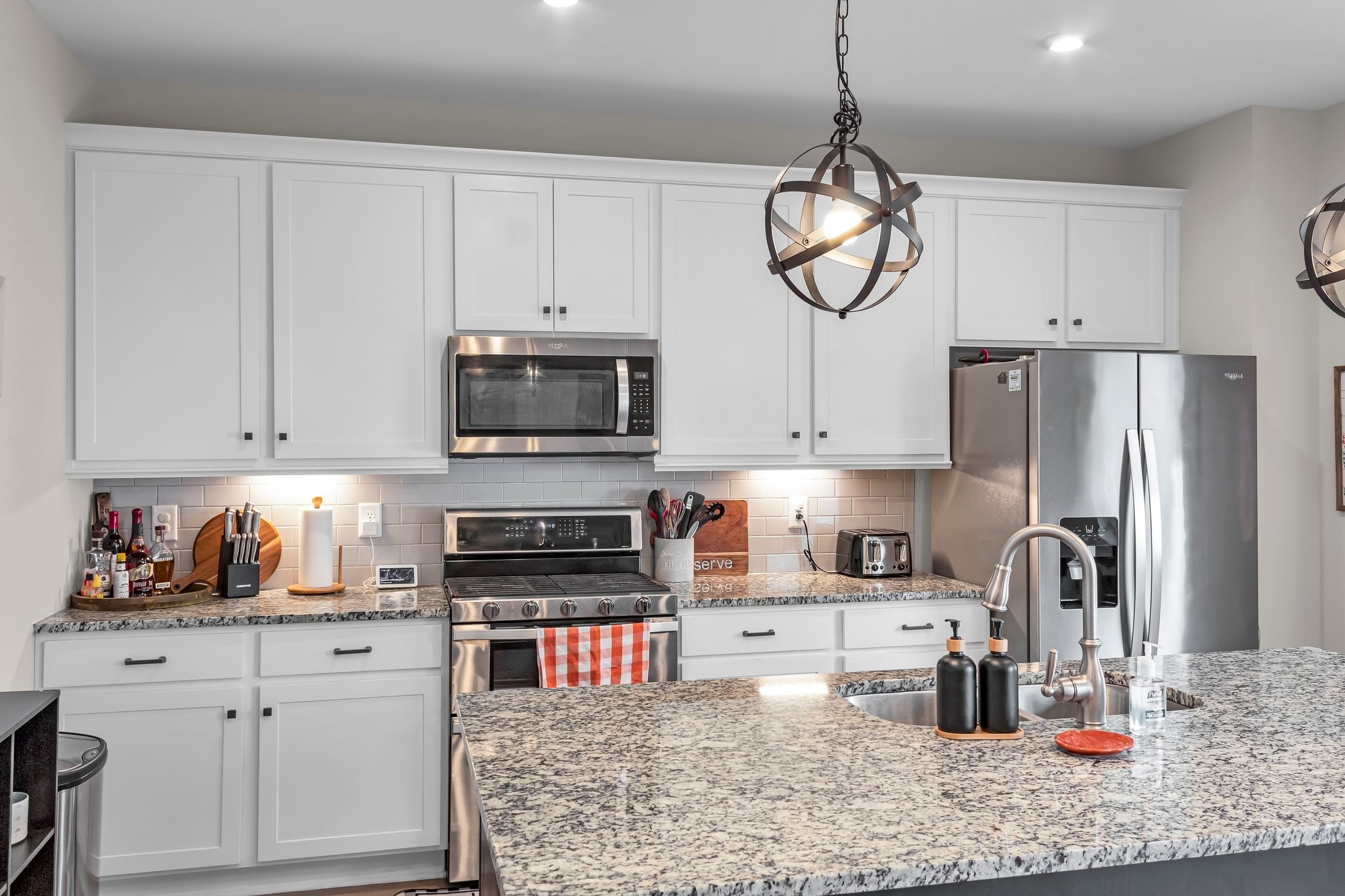 314 Disley Way Murfreesboro, TN 37128 - Photo 9 of 25 a kitchen with stainless steel appliances granite countertop a sink a stove and a refrigerator