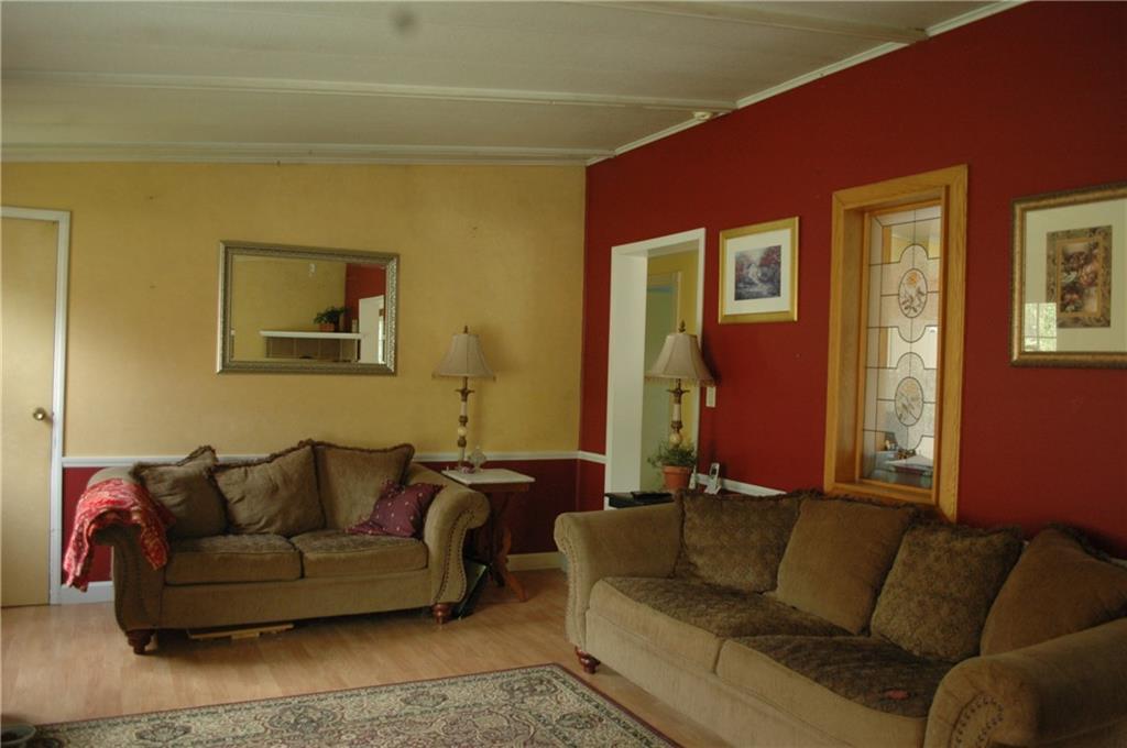 1997 N Road Cornish, ME 04020 - Photo 3 of 21 Large living room has laminate...