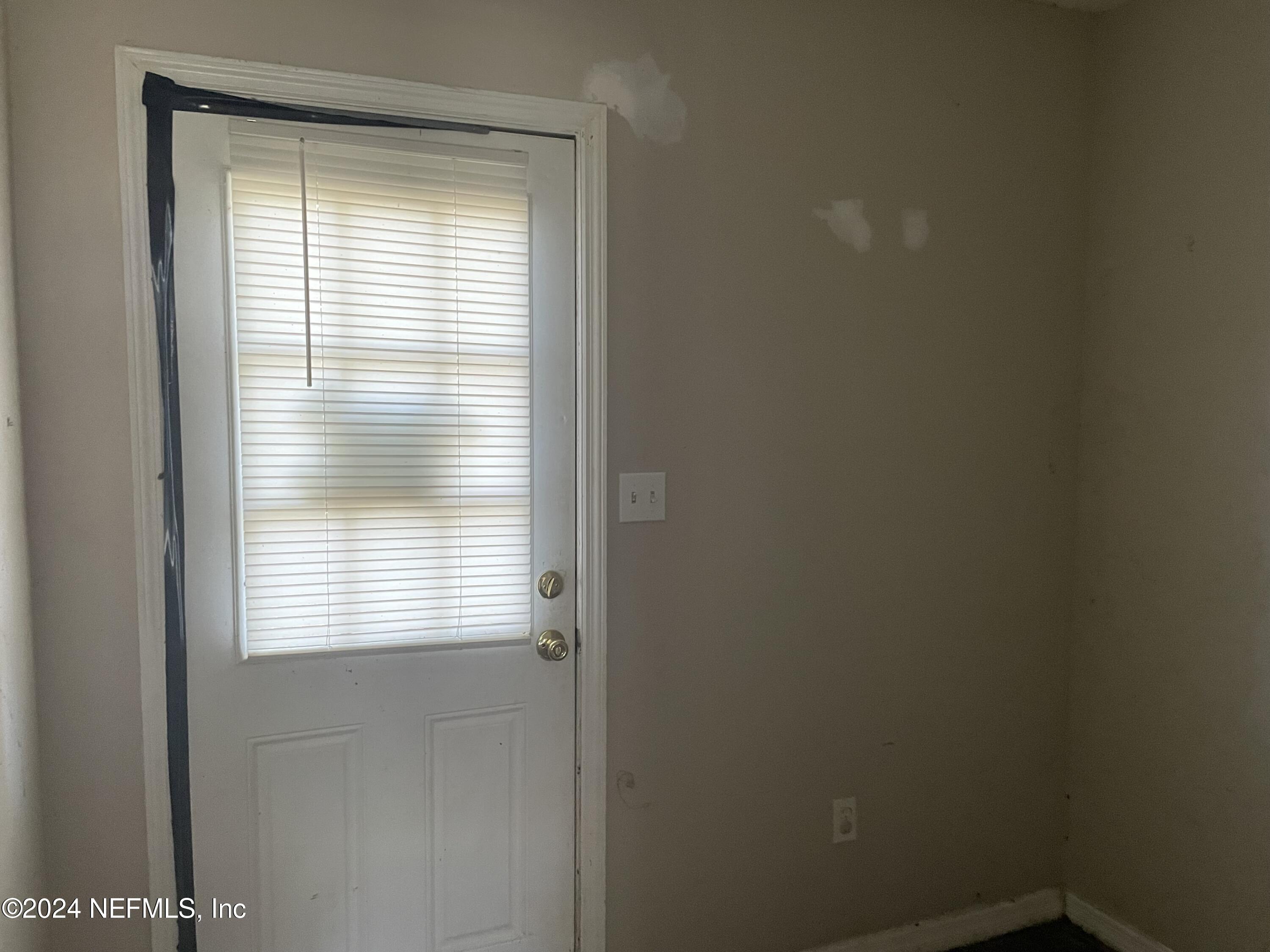 6713 Ector Road Jacksonville, FL 32211 - Photo 12 of 12 a view of an empty room with a window