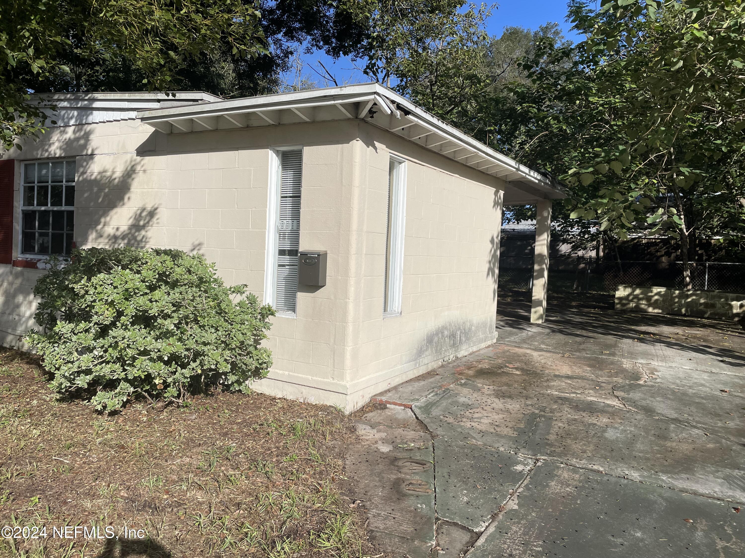 6713 Ector Road Jacksonville, FL 32211 - Photo 2 of 12 a view of a small house with a yard