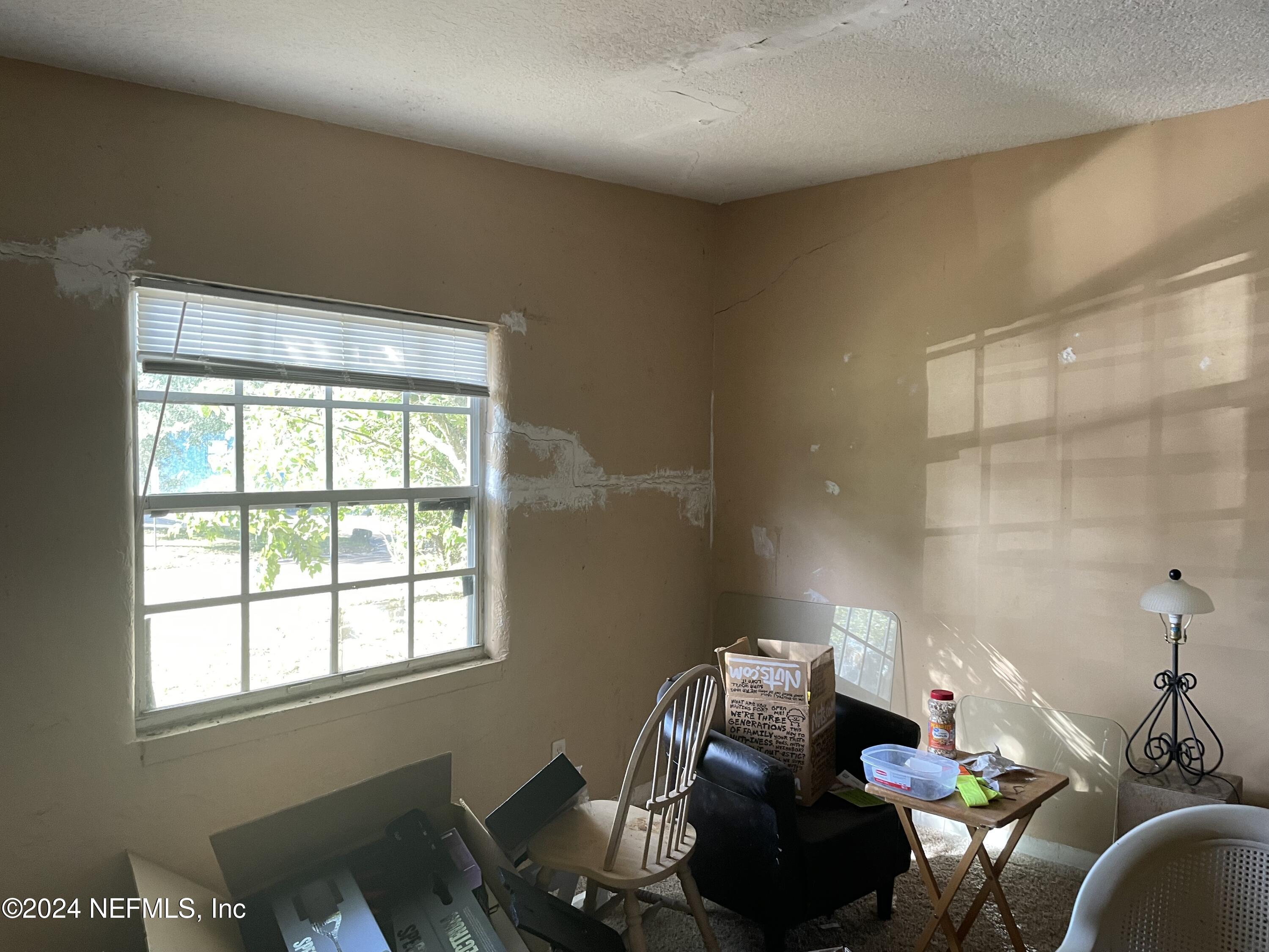 6713 Ector Road Jacksonville, FL 32211 - Photo 6 of 12 a living room with furniture and a window