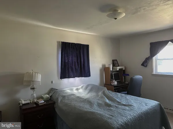 a bedroom with a bed and furniture