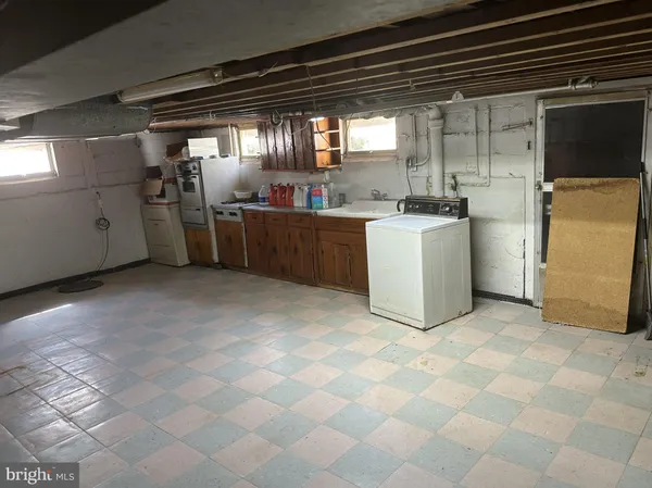 a kitchen with refrigerator and window