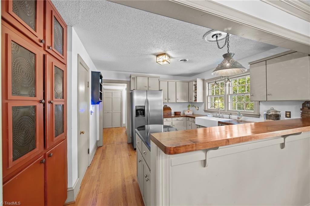 502 West Hunter Street Madison, NC 27025 - Photo 14 of 41 Dining Room/Kitchen with built in Pie Safe and Pantry