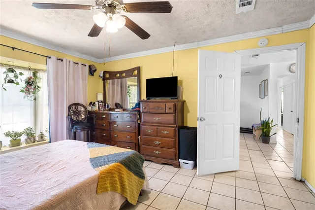 a bed room with a bed and a television