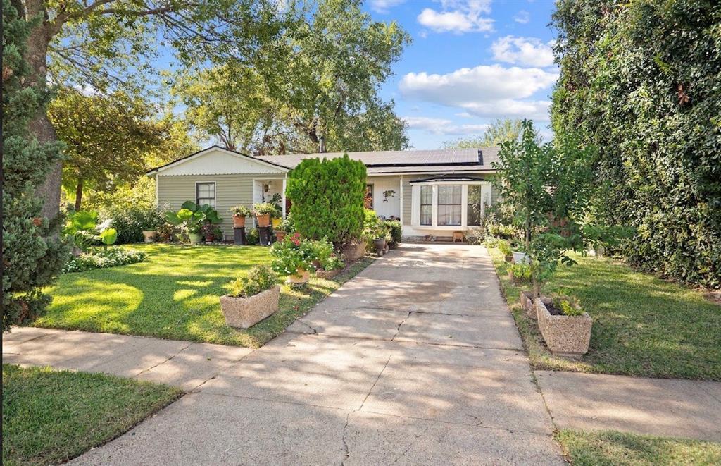 1255 Olden Street Dallas, TX 75211 - Photo 2 of 14 a front view of a house with a yard