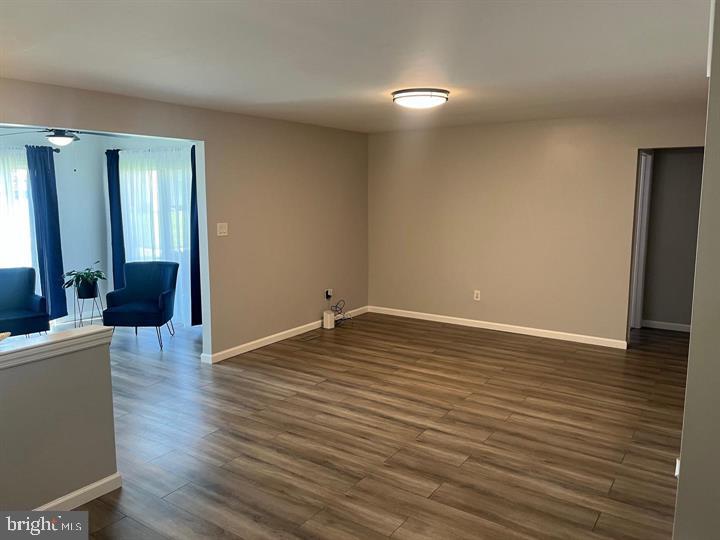 11 Kent Place Sewell, NJ 08080 - Photo 3 of 17 a view of an empty room with wooden floor and a cabinet
