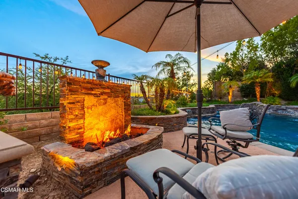 a living room with furniture and a dining table