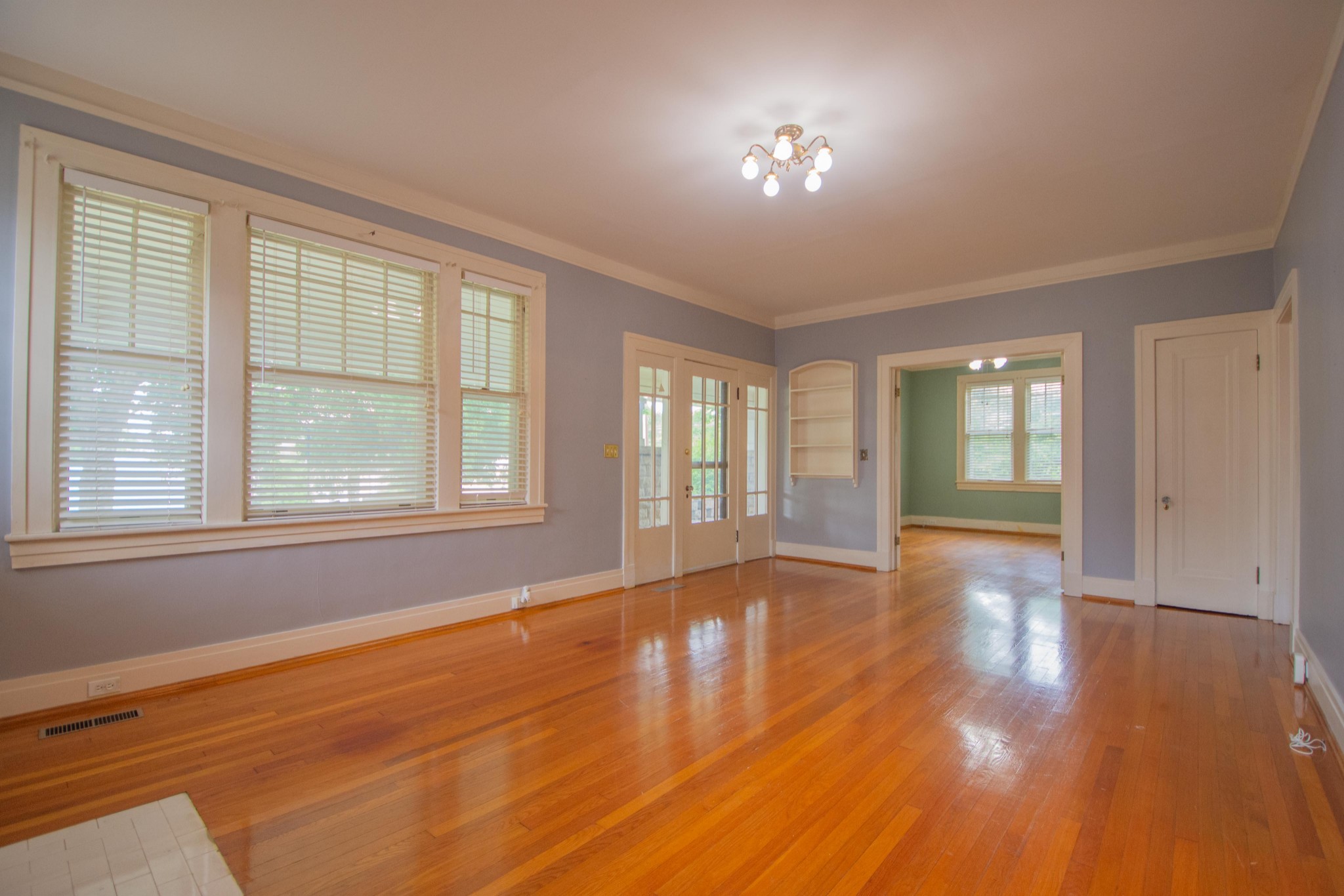 311 South 3rd Street Pulaski, TN 38478 - Photo 12 of 44 a view of empty room with wooden floor and fan