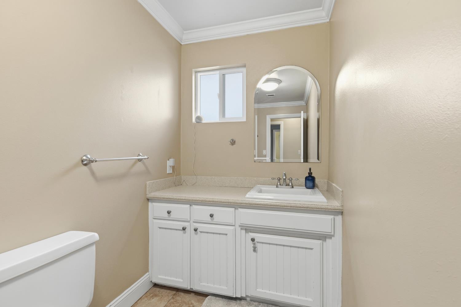 550 Bell Street Turlock, CA 95380 - Photo 20 of 36 a bathroom with a sink a toilet and a mirror
