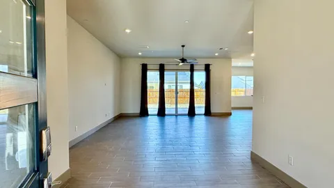 a kitchen with stainless steel appliances granite countertop a refrigerator and a stove