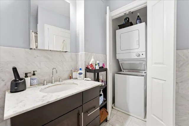 a kitchen with a sink cabinets and appliances