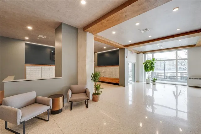 a view of living room with furniture and a flat screen tv