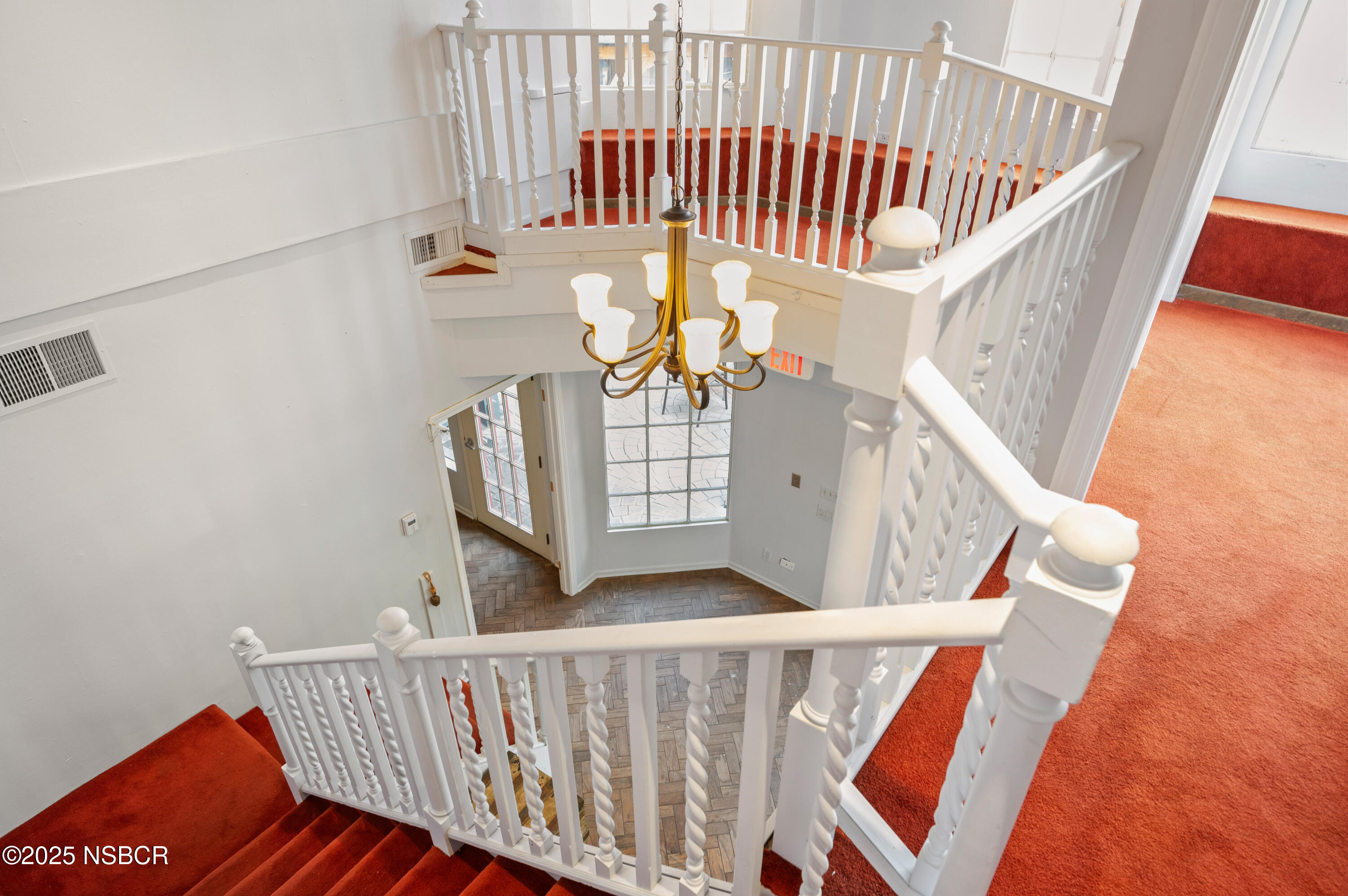 437 2nd Street Solvang, CA 93463 - Photo 11 of 39 a view of staircase with railing and white walls