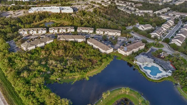an aerial view of a house with garden space and street view