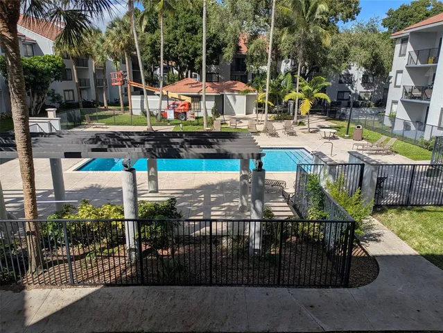 a view of a chairs and table in the patio