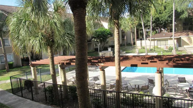 a view of a swimming pool with a patio