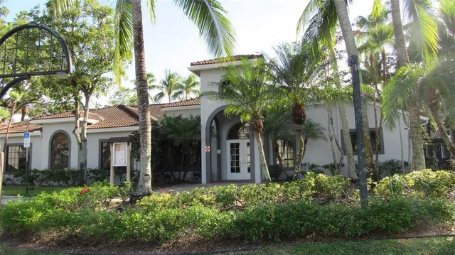 a view of a park with palm trees