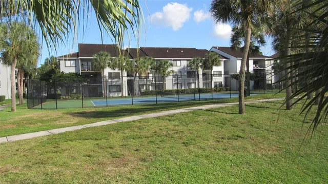 a view of a house with a backyard