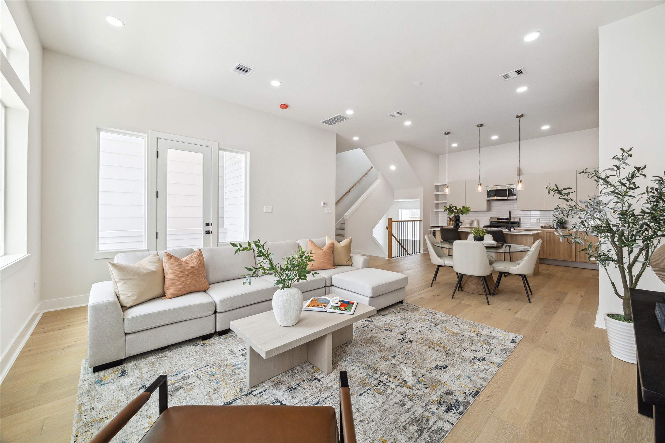 3911 Tulane Street, Unit B Houston, TX 77018 - Photo 9 of 37 Experience seamless living in this open-concept space, featuring a bright living area, elegant dining space, and a modern kitchen perfect for entertaining.