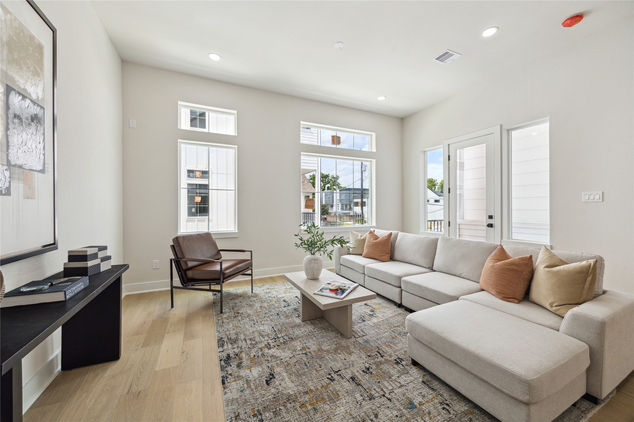 3911 Tulane Street, Unit B Houston, TX 77018 - Photo 10 of 37 Bright and inviting living room with abundant natural light, modern design, and ample seating—perfect for relaxation and entertaining.