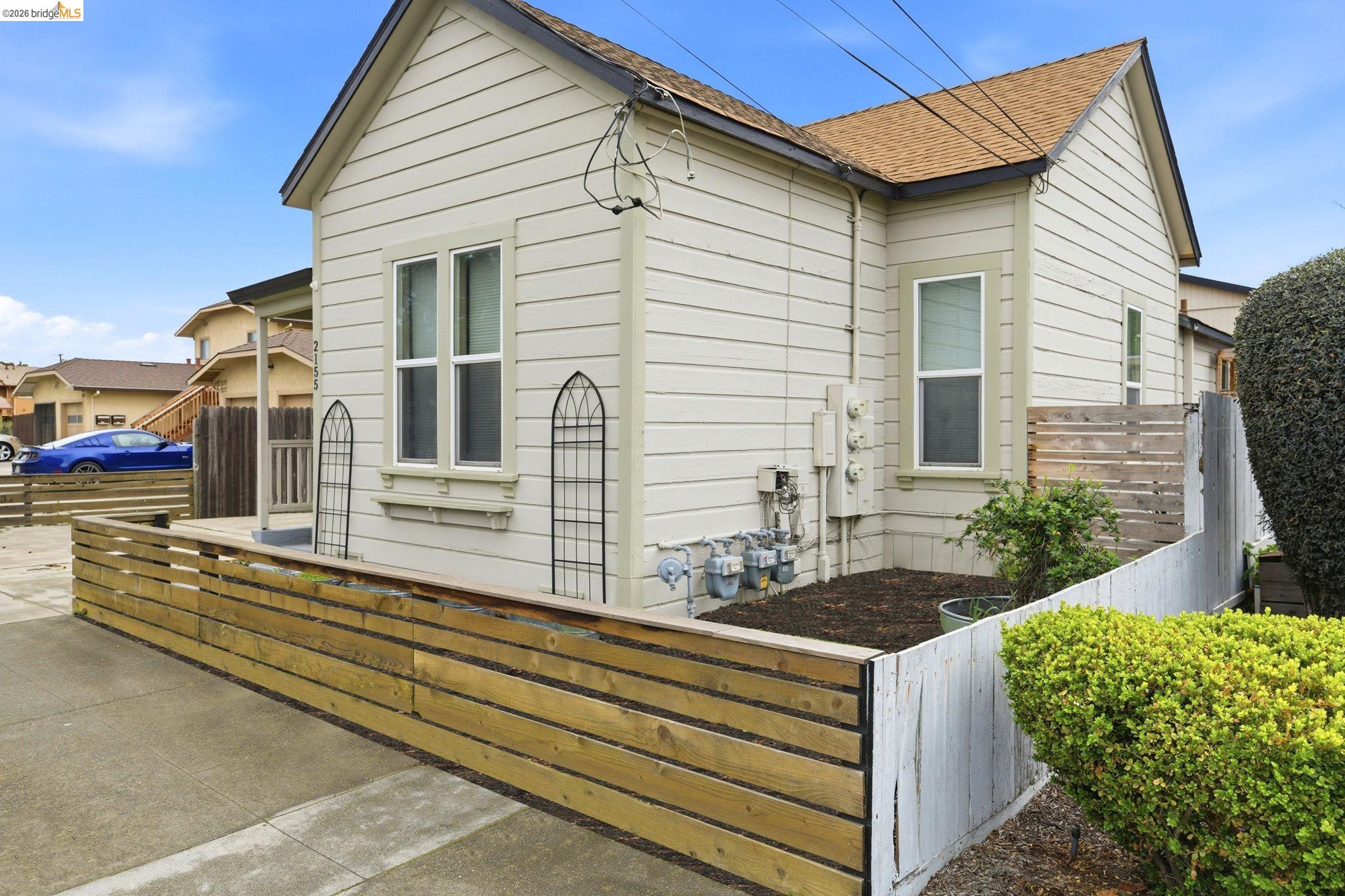 2155 Chestnut Street Livermore, CA 94551 - Photo 2 of 44 Bungalow-style home featuring a fenced front yard and roof with shingles