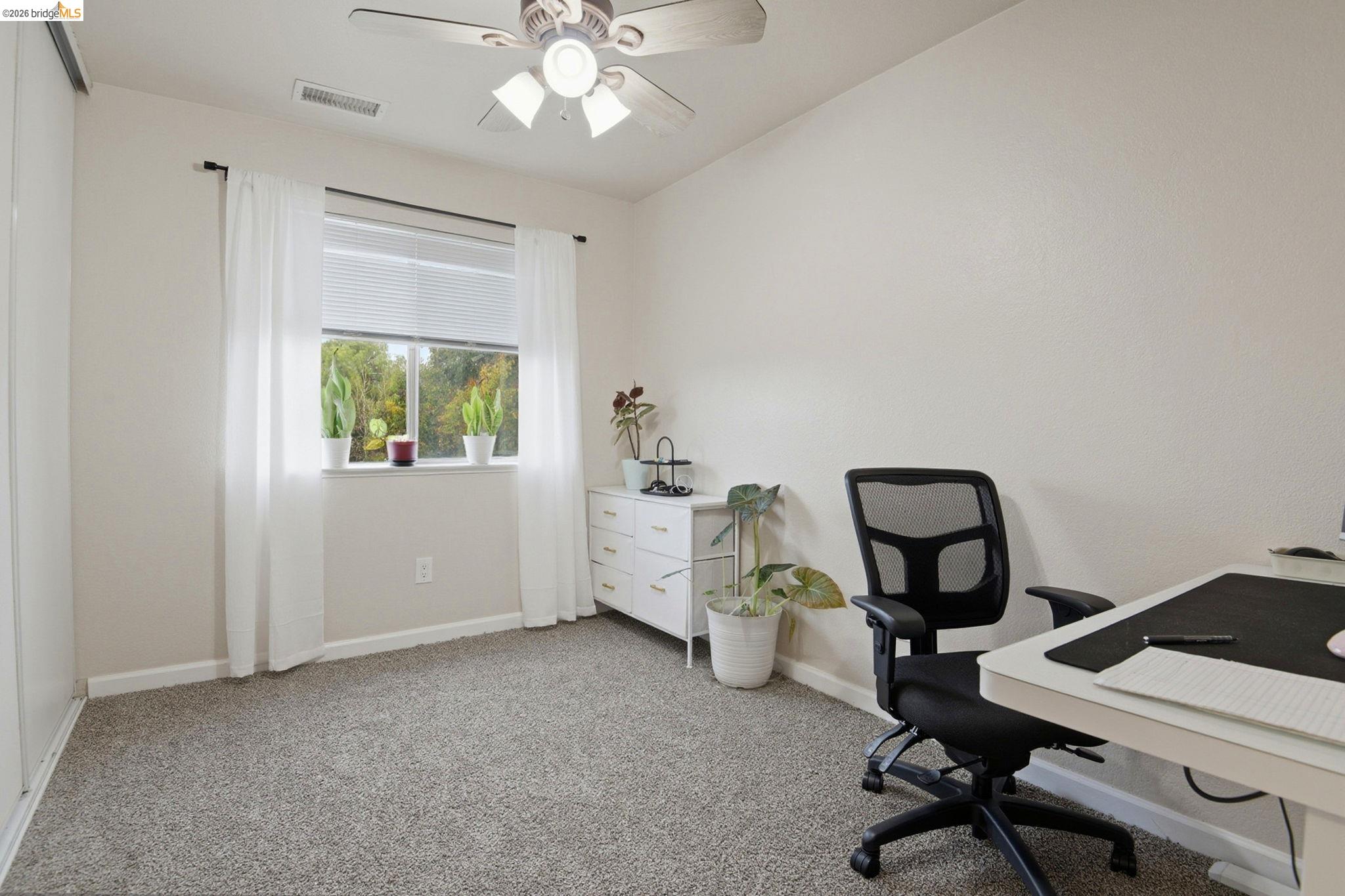 2155 Chestnut Street Livermore, CA 94551 - Photo 42 of 44 Home office with light carpet and ceiling fan