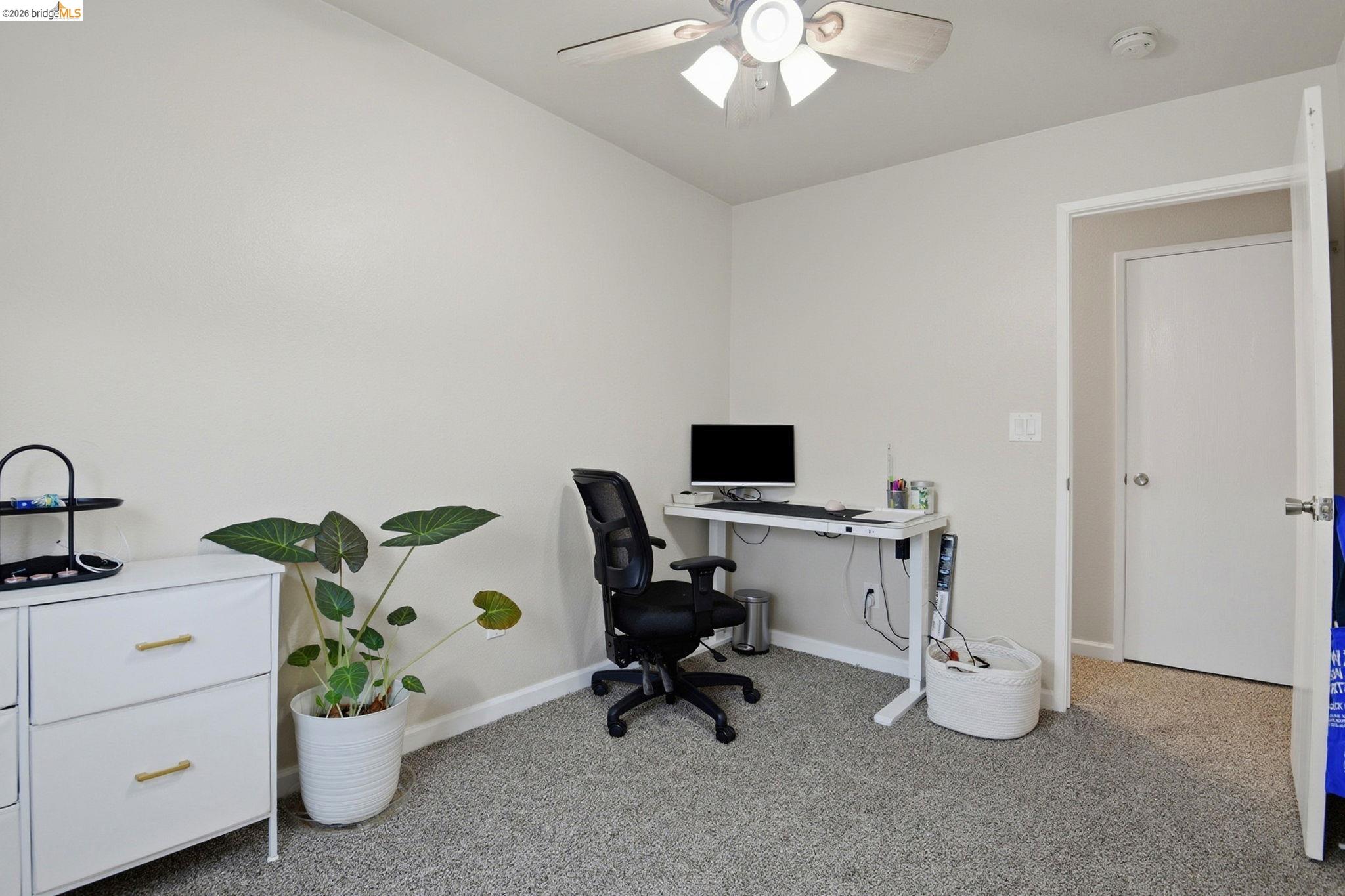 2155 Chestnut Street Livermore, CA 94551 - Photo 43 of 44 Home office with light carpet and ceiling fan
