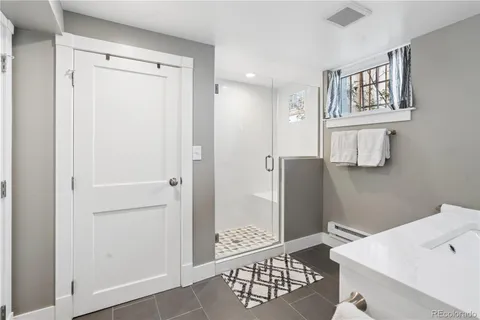 a bathroom with a bathtub and a sink