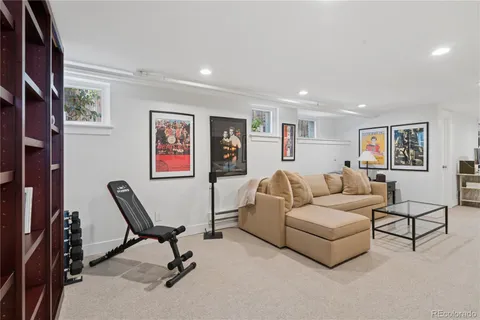 a living room with furniture and a rug
